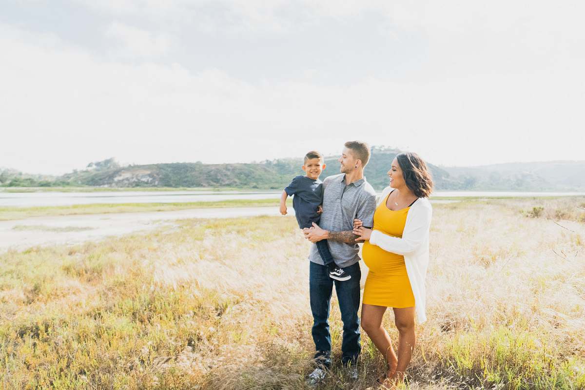 person man and woman standing outdoors family