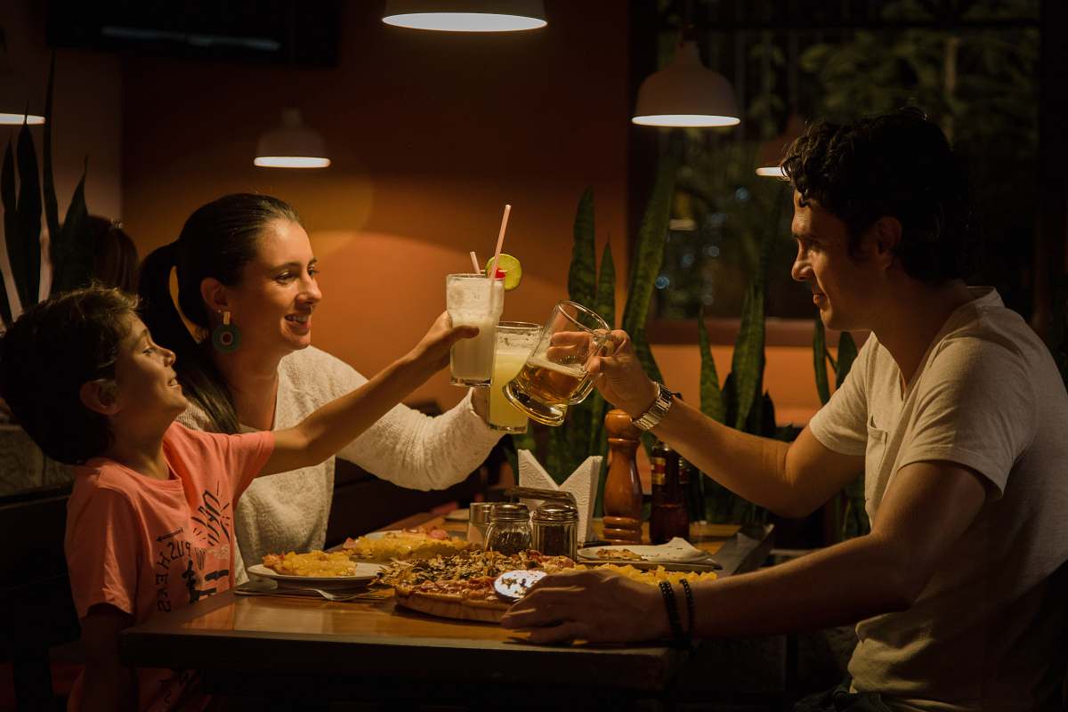 person three people having a toast on table people