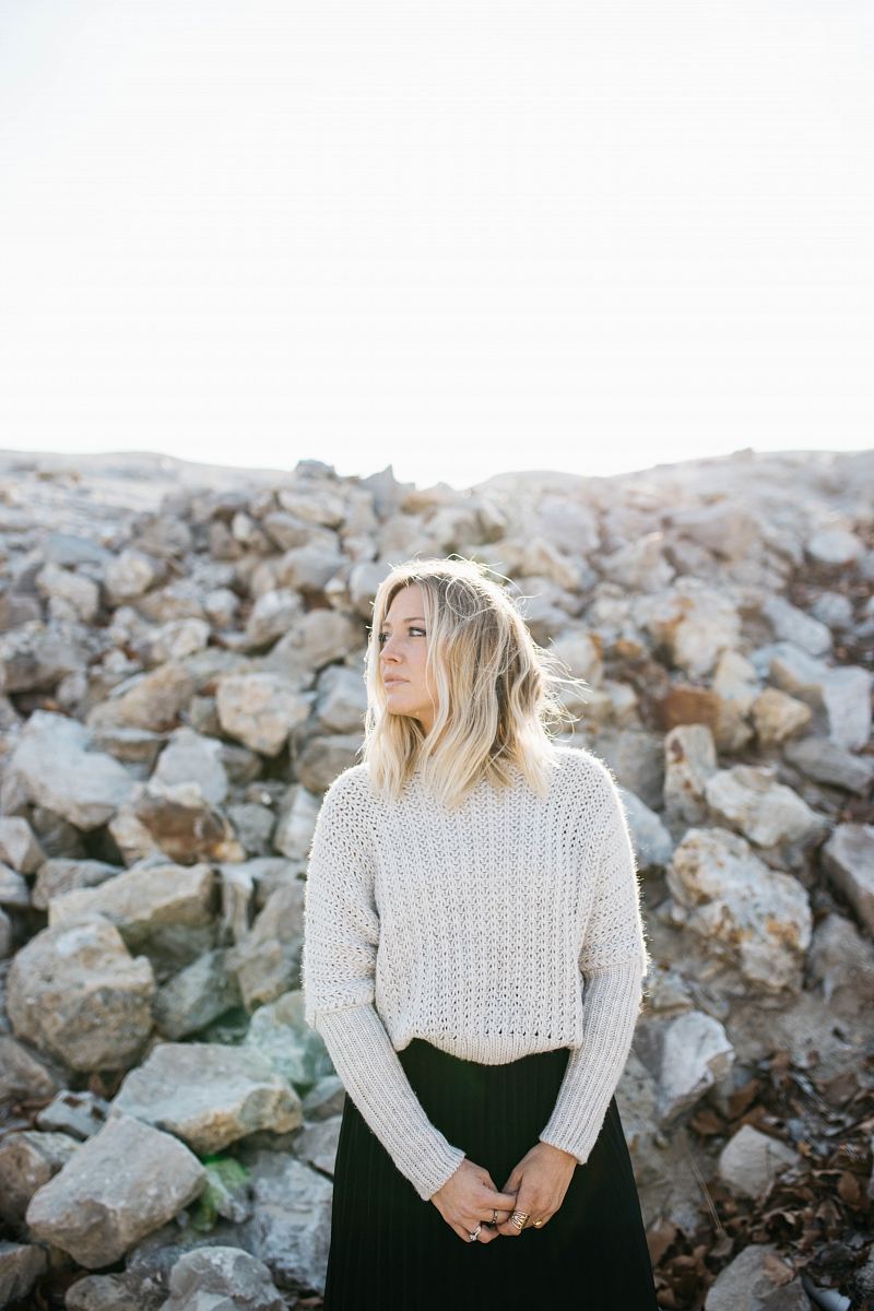 woman in gray sweater and black skirt