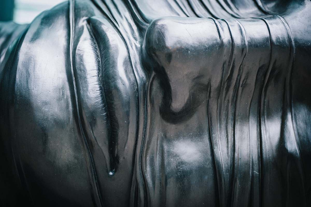 sculpture close-up photo of human face with gray paint face