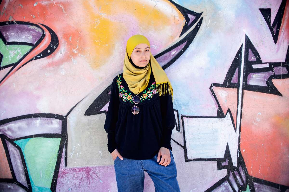 human woman standing near wall person