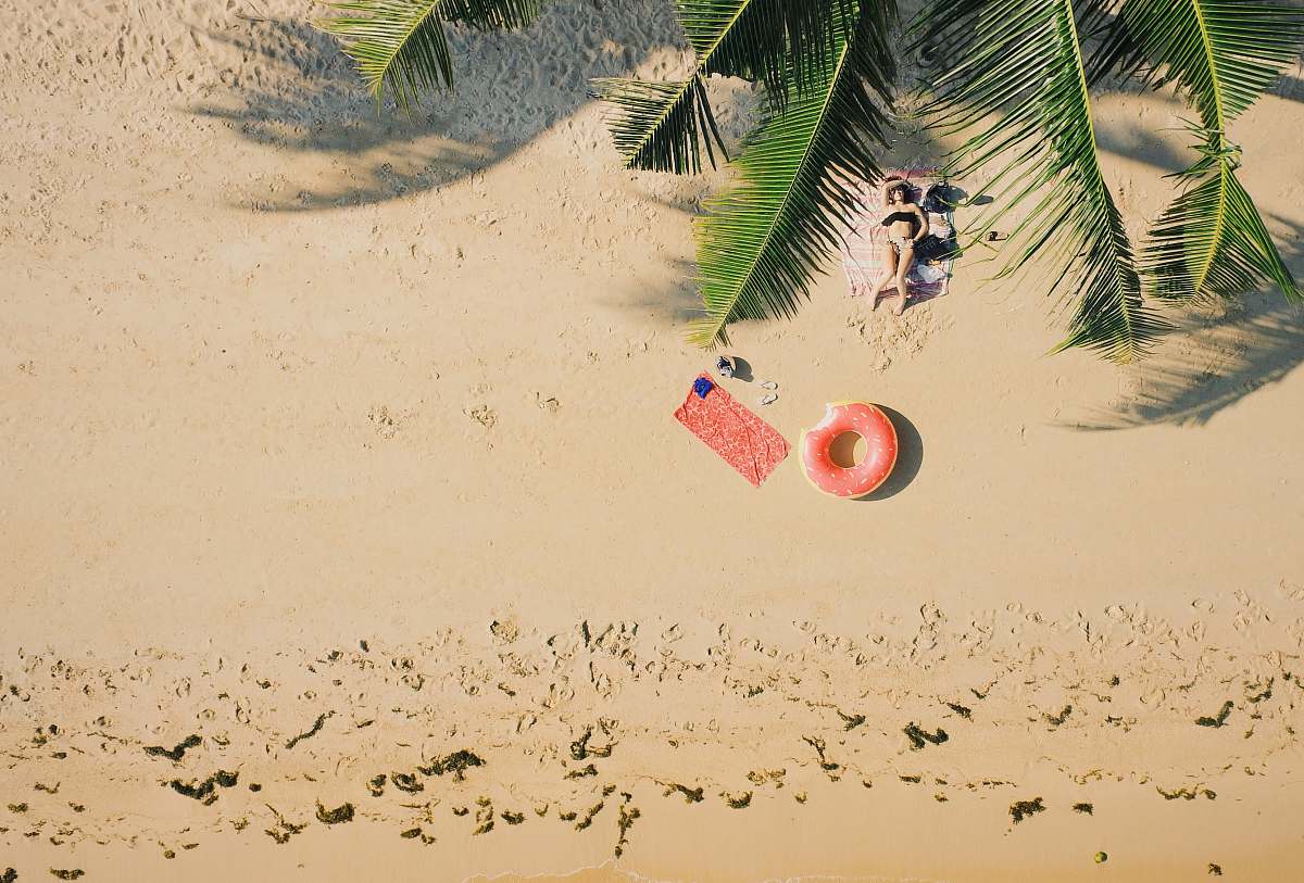 summer woman lying on shore during daytime sand