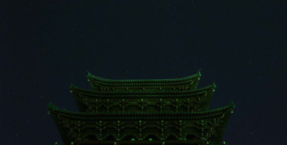 building A building illuminated with green lights. temple