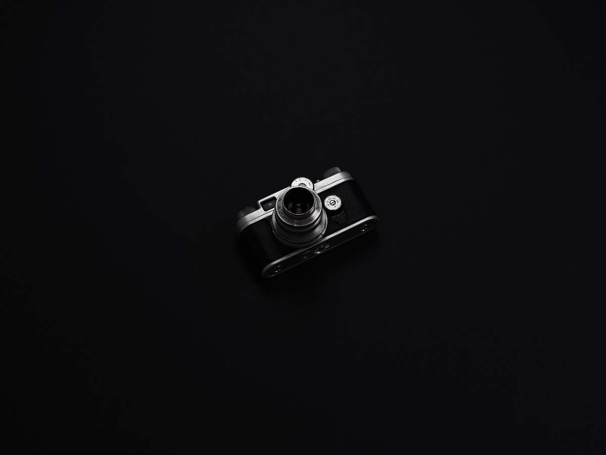 black DSLR camera with black background camera