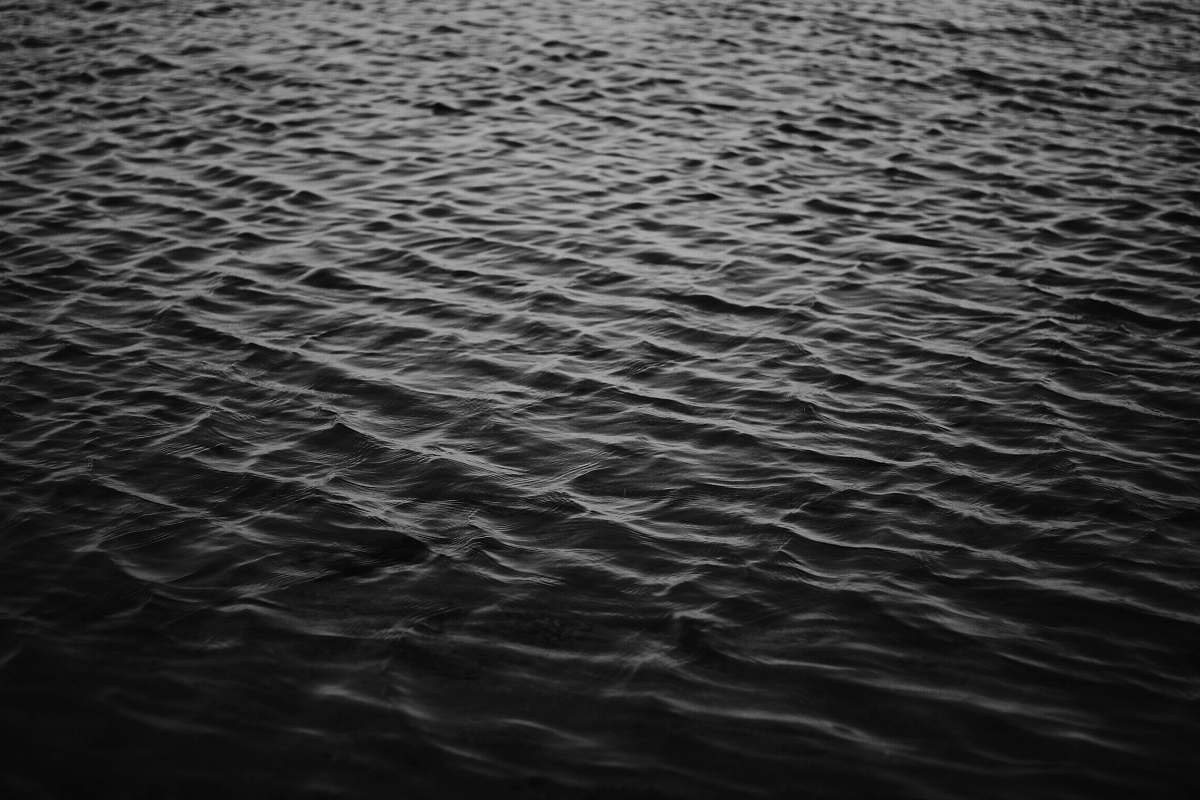 water grayscale photo of sea ripple