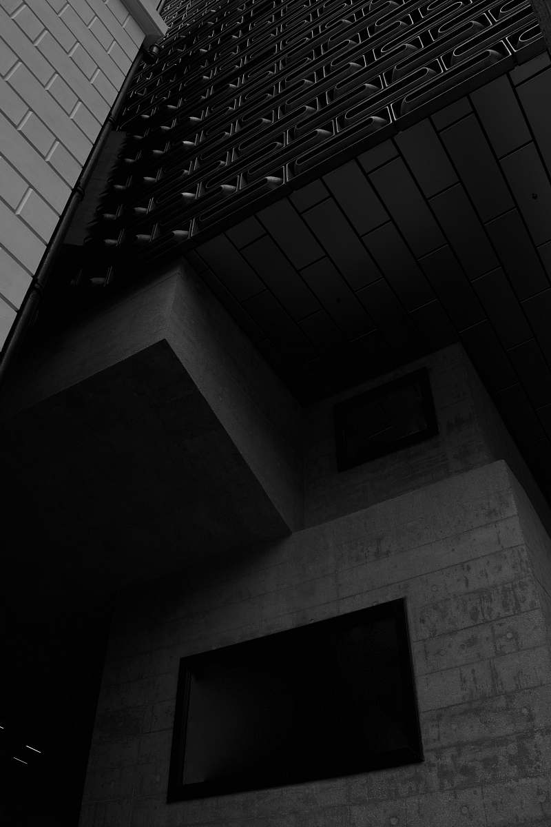 banister view of a gray building handrail
