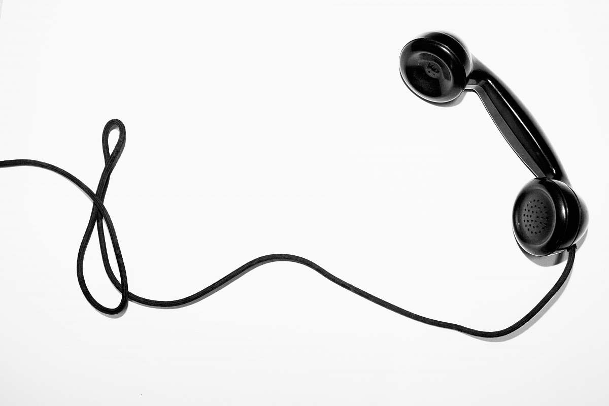 black-and-white black corded telephone white