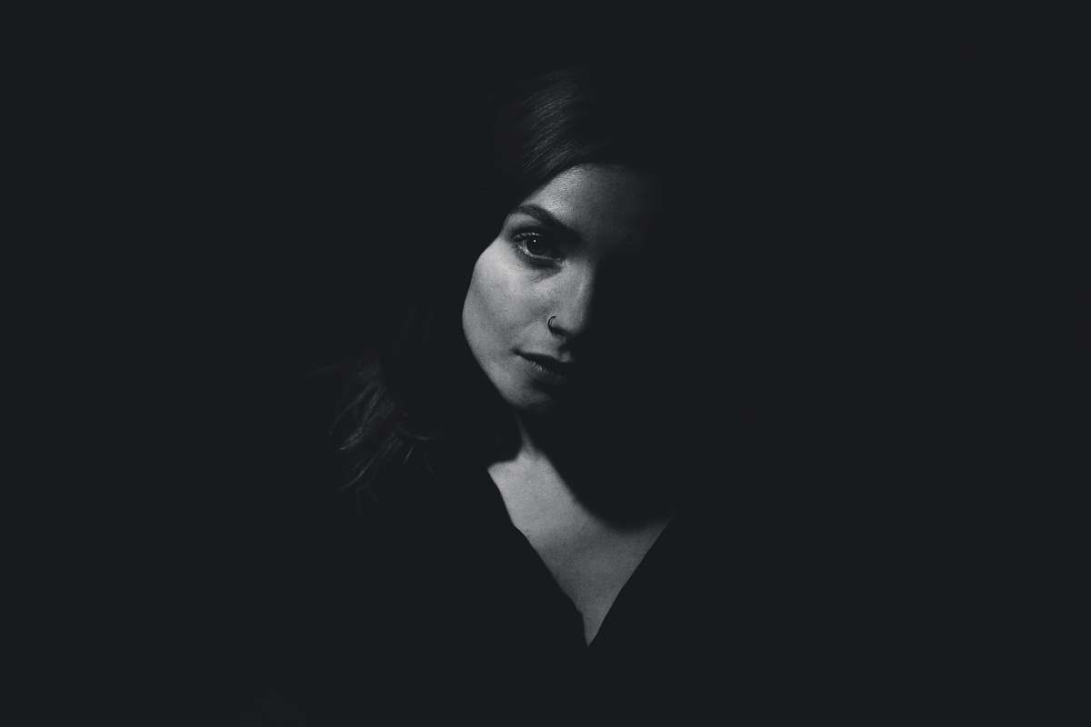 person black haired woman with black background human