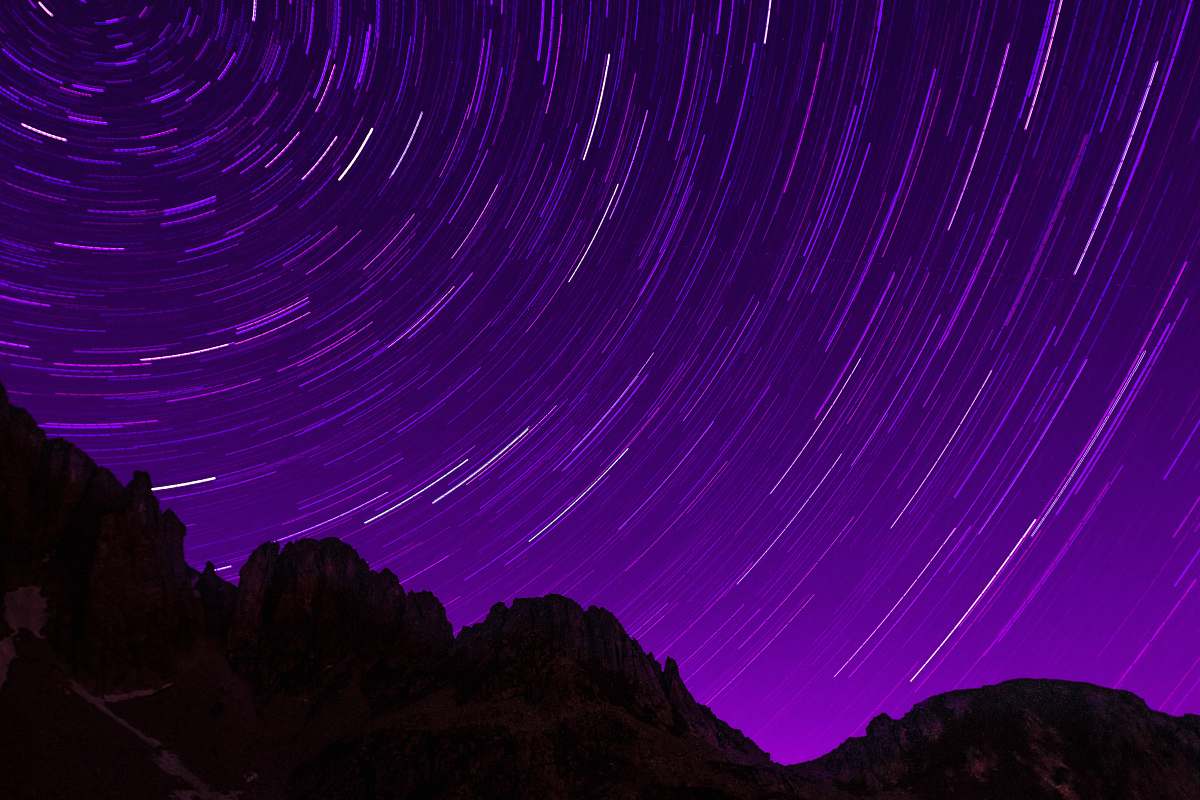 nature silhouette photography of mountain under galaxy outdoors