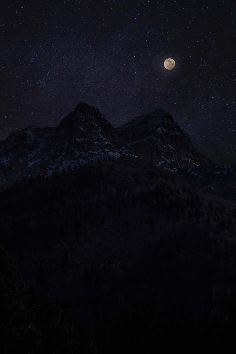 outdoors snow capped mountain during night time outer space