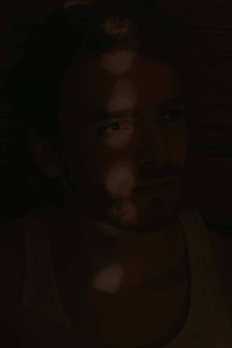 person sun kissed photography of man human