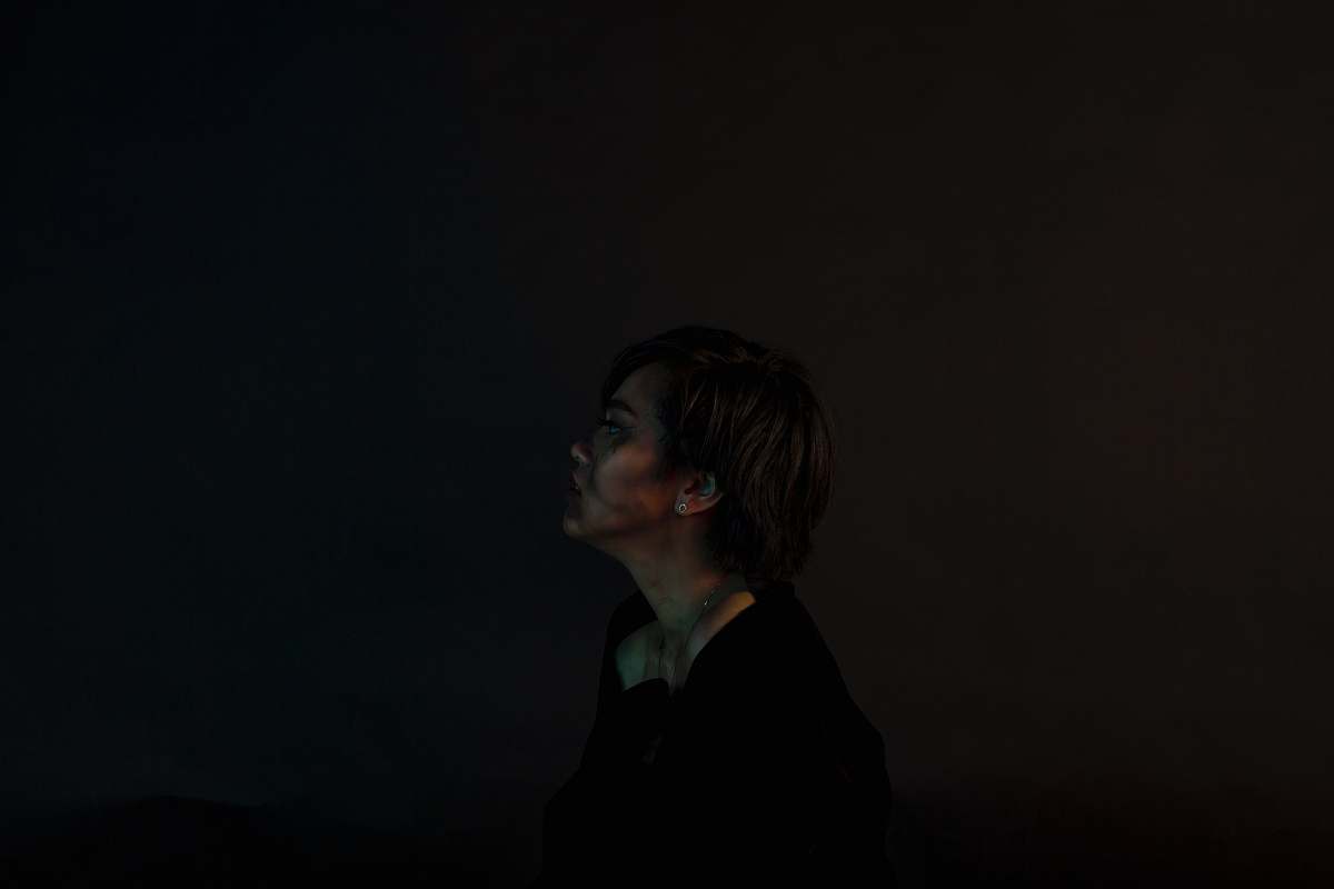 person woman standing near black surface human