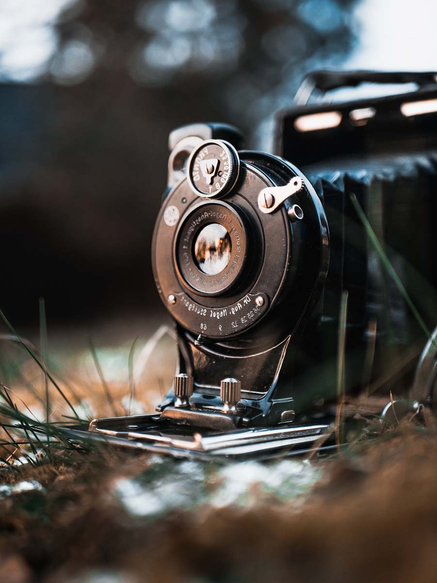old black land camera on grass land schwerin