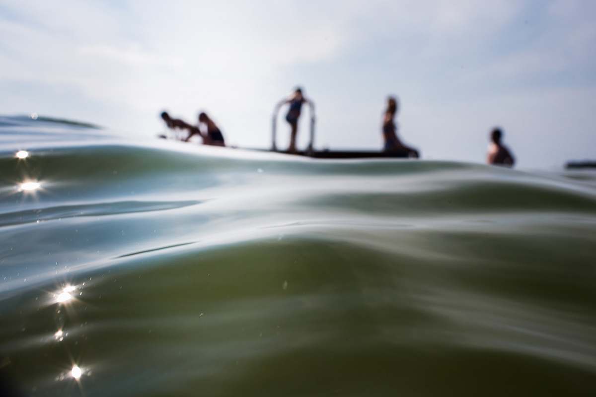 person people on body of water during daytime water