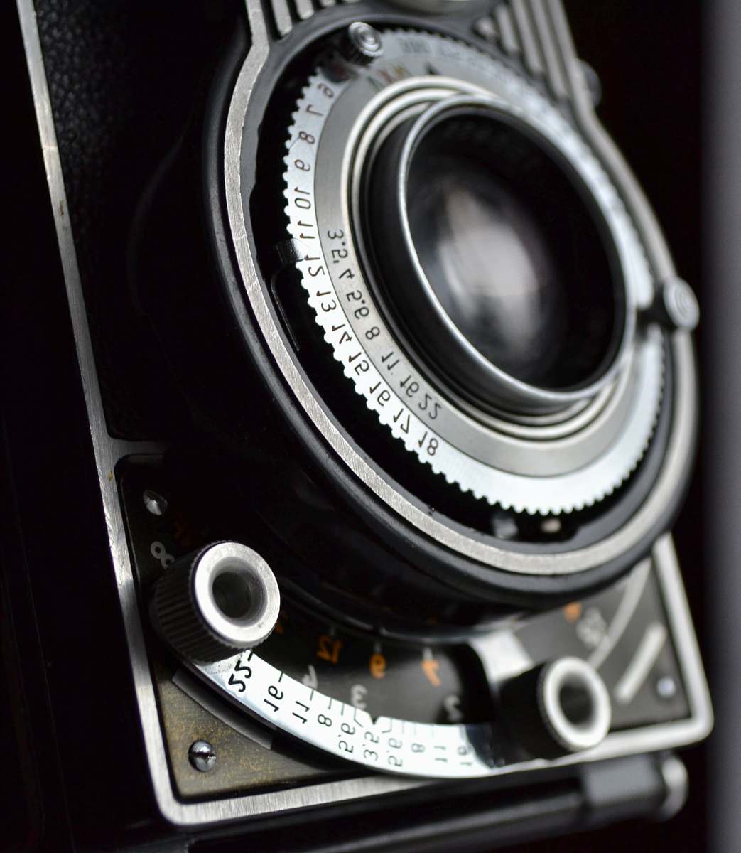 camera close view of black and gray film camera electronics
