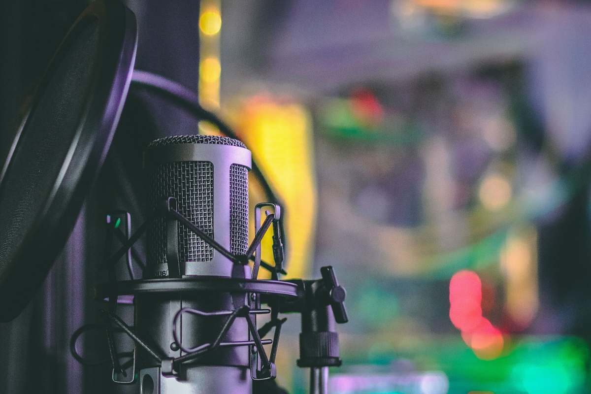 macro gray condenser microphone with pop filter in closeup photography audio