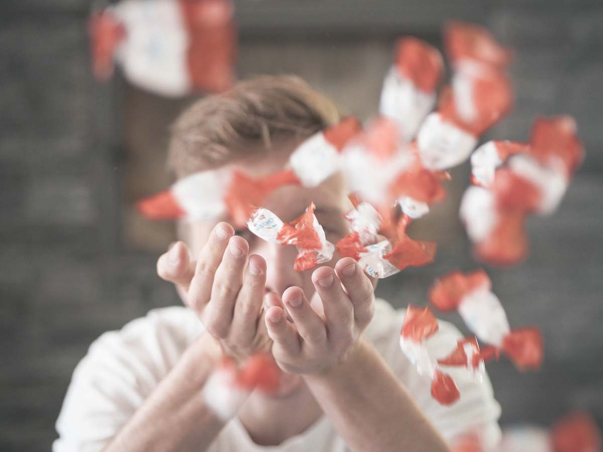 human man scattering flower petals people