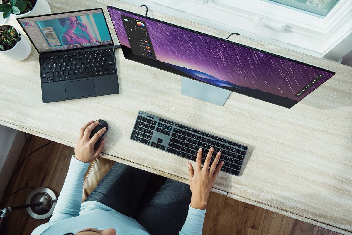 electronics person using laptop on table keyboard