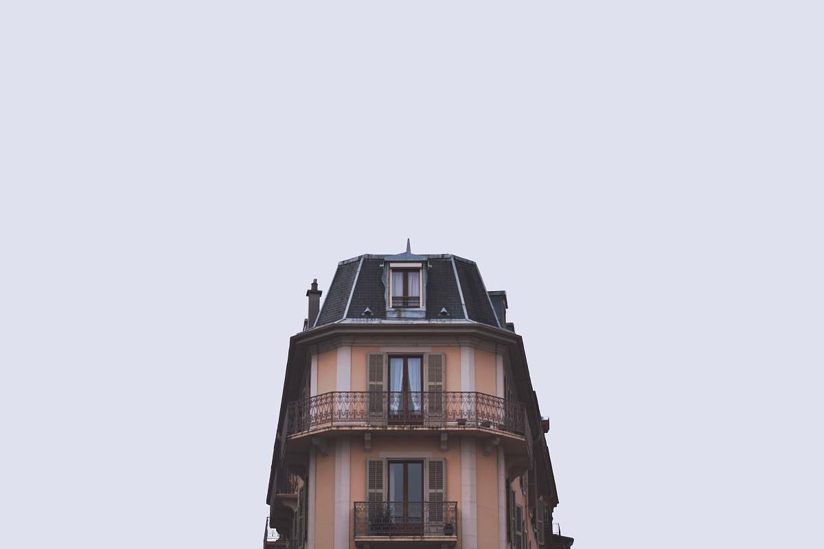 building brown and black building under white sky city