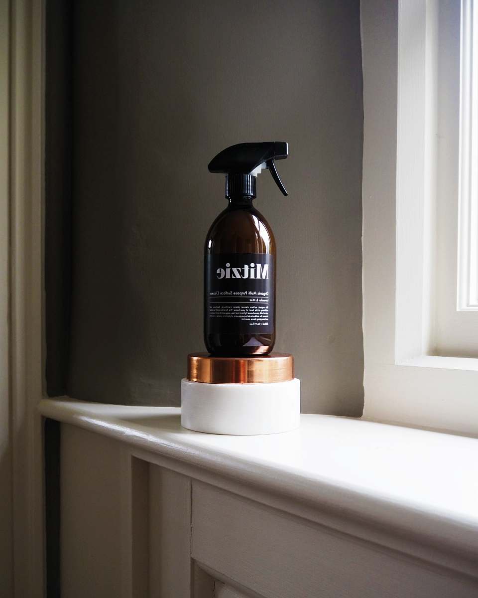 london black Mitzie spray bottle near window home decor