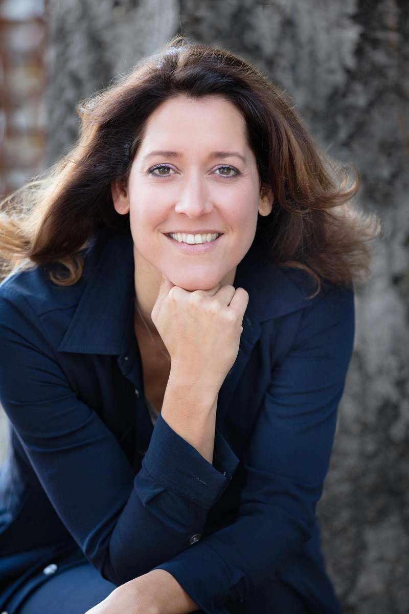 apparel smiling woman with hand on chin clothing