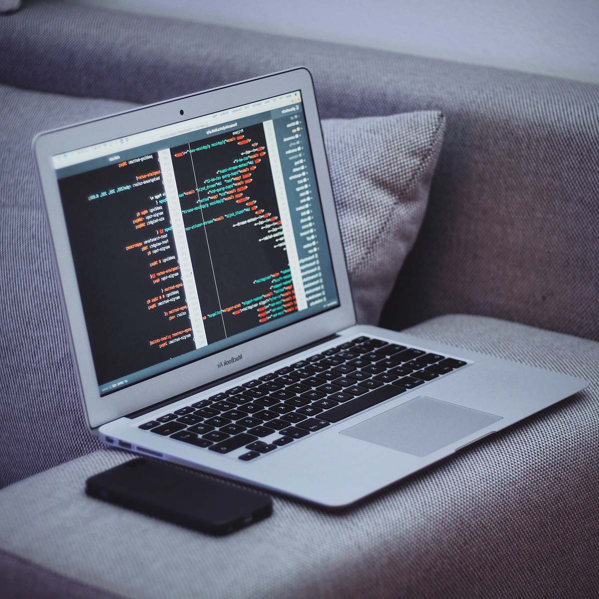 computer MacBook Air on gray armchair pc