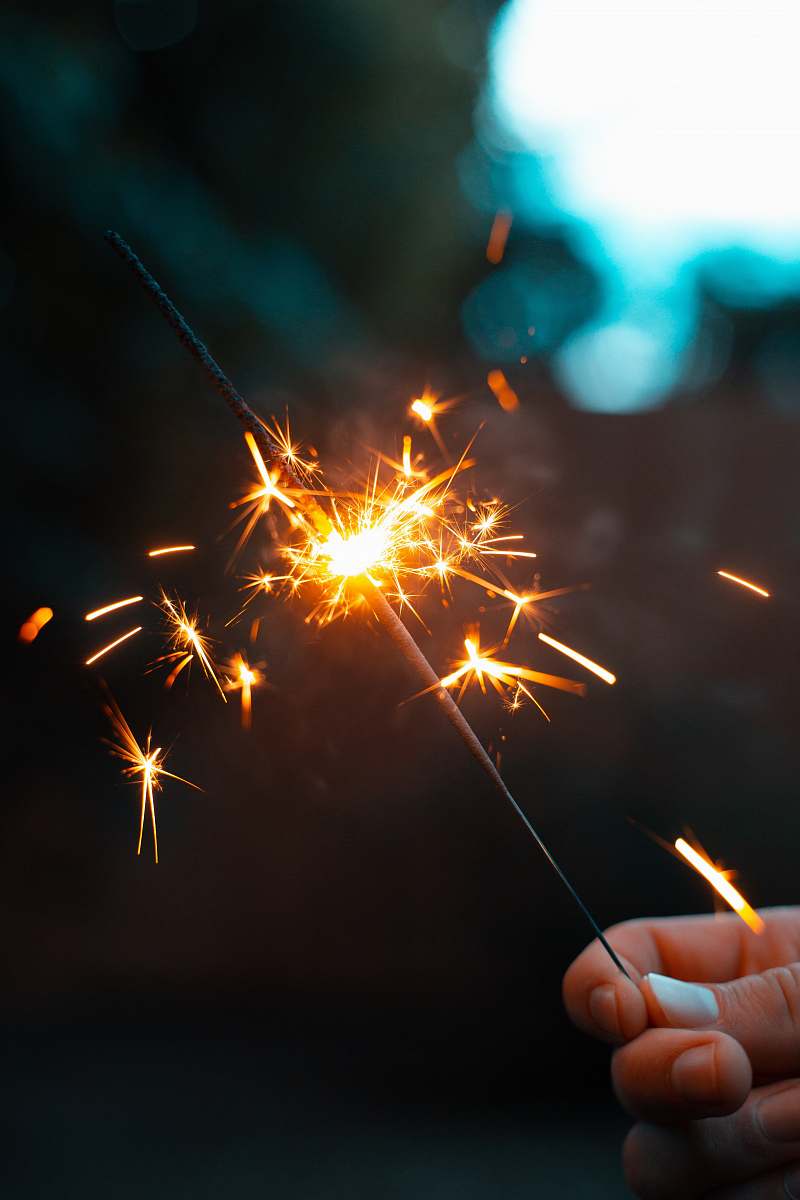 outdoors person holding sparkler night