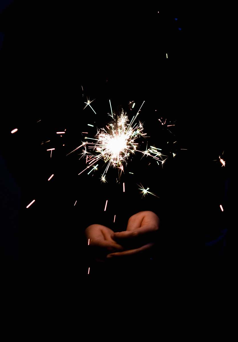 fireworks person holding sparkles outdoors