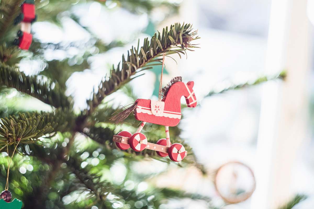 jewelry close-up photography of Christmas tree horse decoration pearl