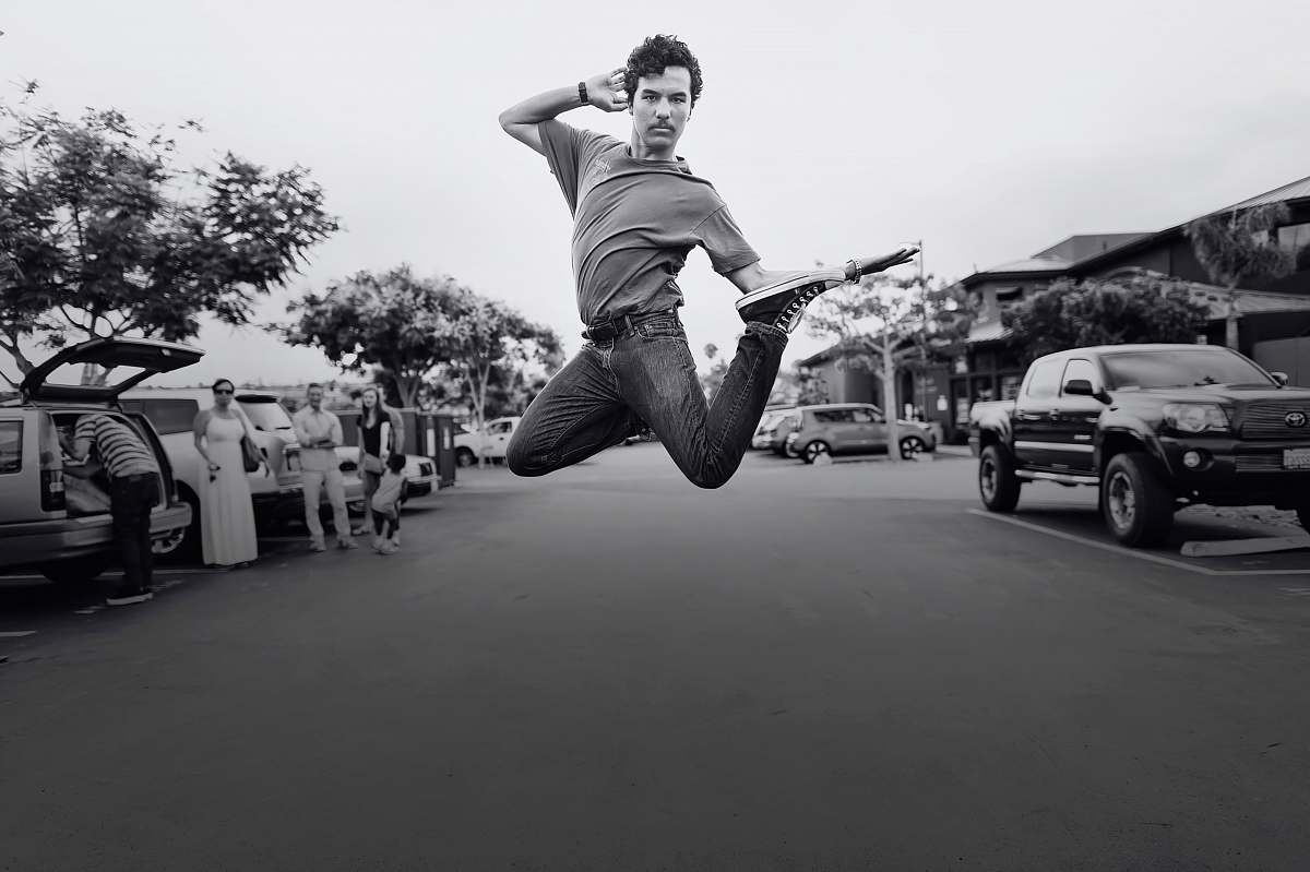 black-and-white grayscale jumping photo of man human