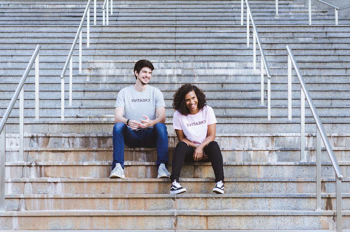 human man and woman sitting on stairs shoe