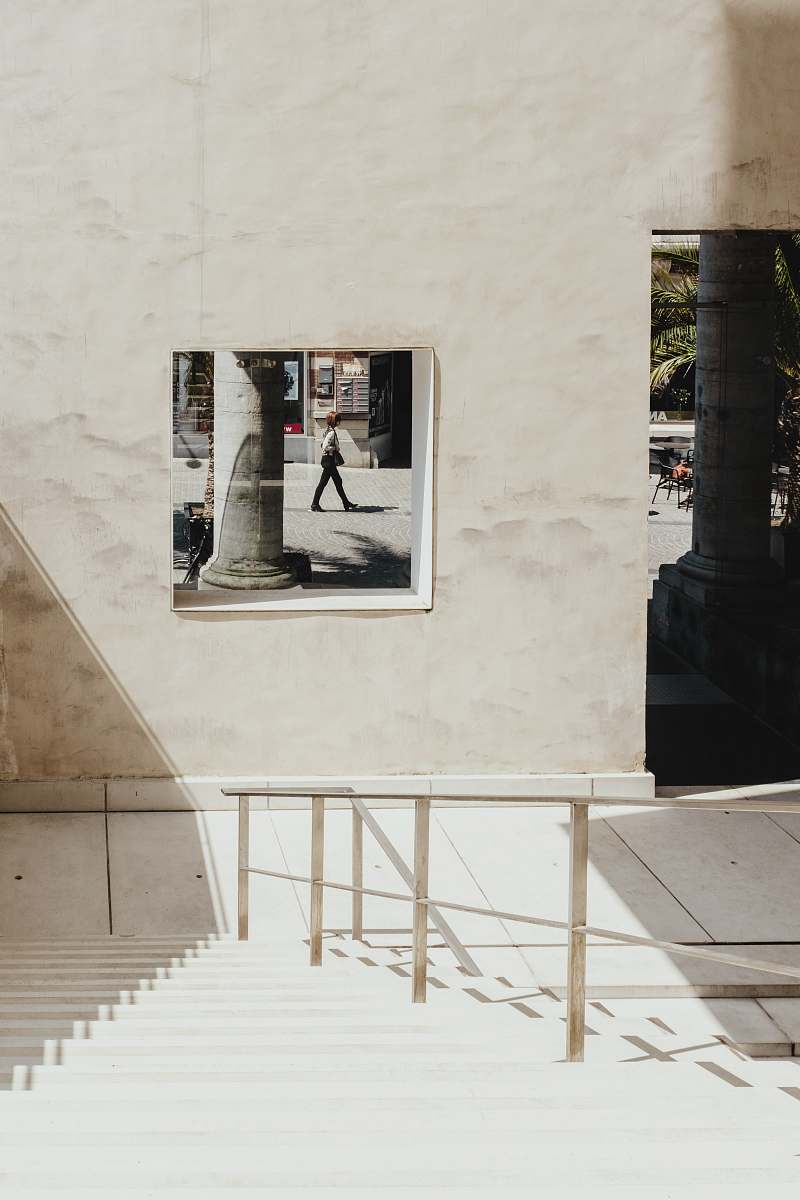 grey woman walking on a street city