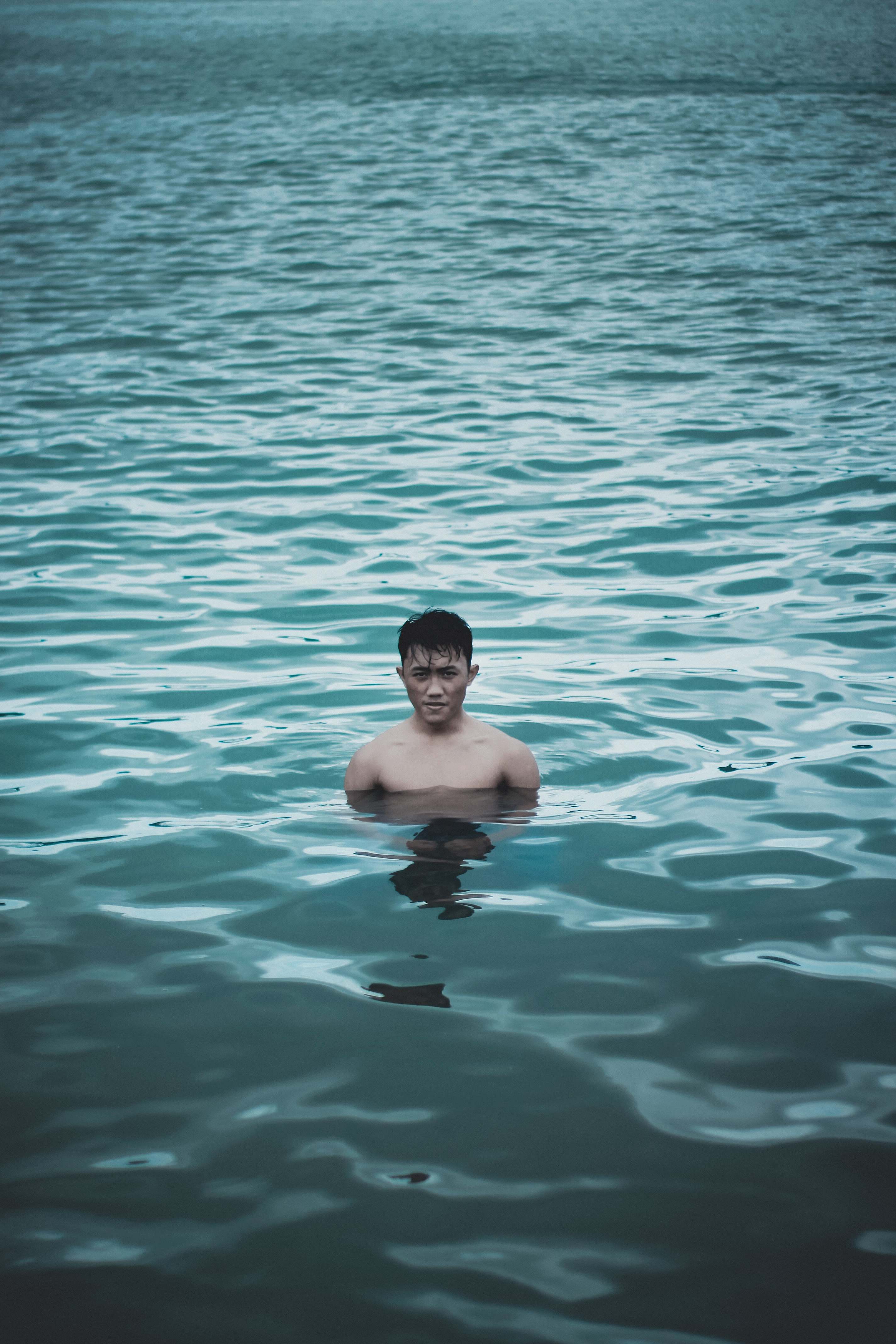Human Man Bathing On Calm Water Person Image Free Photo