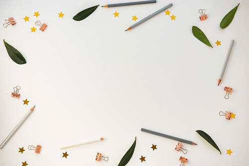 brown pencils on white panel desk