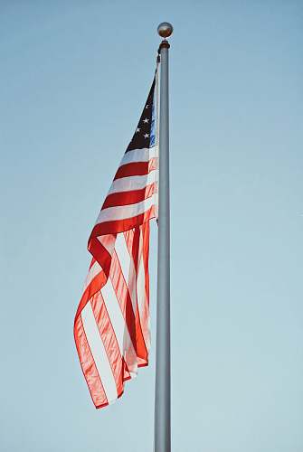 symbol US flag under clear sky at daytime american flag