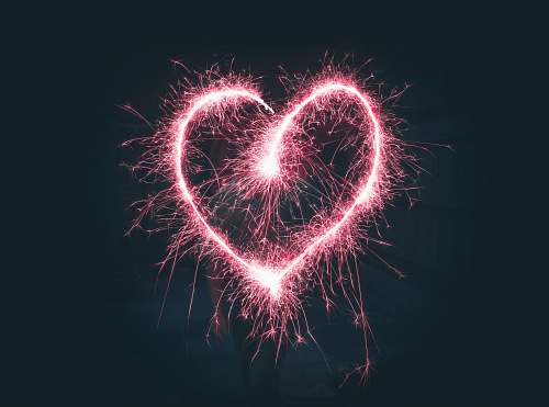 night heart shaped pink sparklers photography outdoors