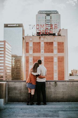 human man and woman hugging each other people
