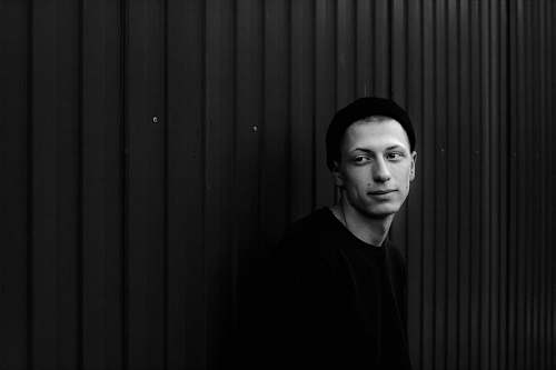 person grayscale photo of man human