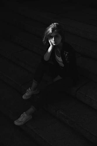 clothing woman sitting on concrete stair apparel