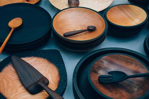 wood ladles on round brown wooden plate lot wood bowl