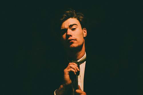 people man holding necktie human
