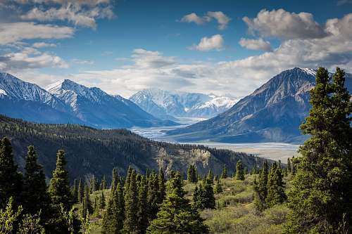 nature green mountain across body of water landscape