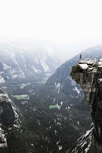 nature man on mountain cliff valley