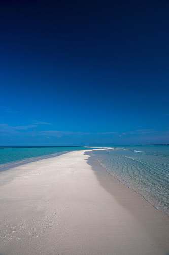 sea beach sand during daytime shoreline