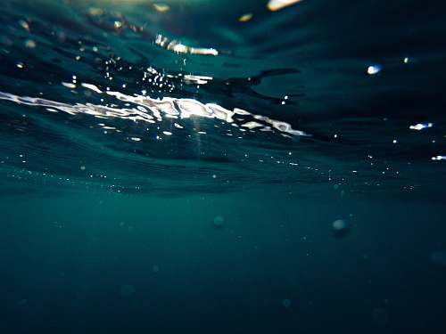sea closeup photo of green water formation ocean
