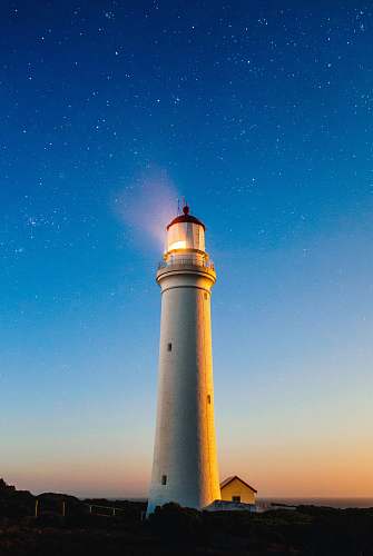 stars white concrete lighthouse lock screen background