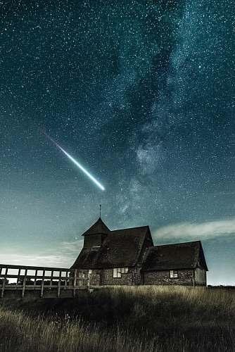 night brown house under stary night galaxy