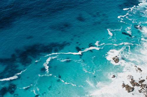 ocean aerial view of seashore with stones sea