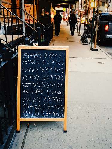 human coffee signs near buildings person