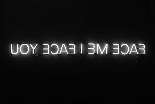 black-and-white face me i face you text with black background neon